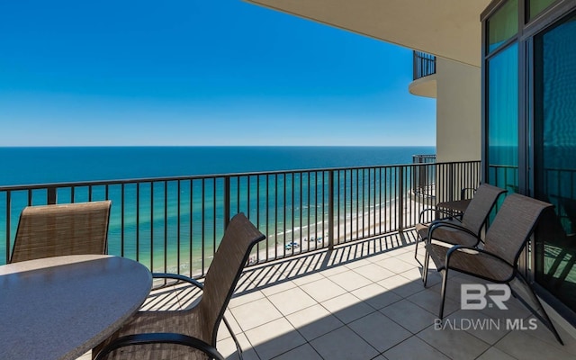 balcony featuring a water view