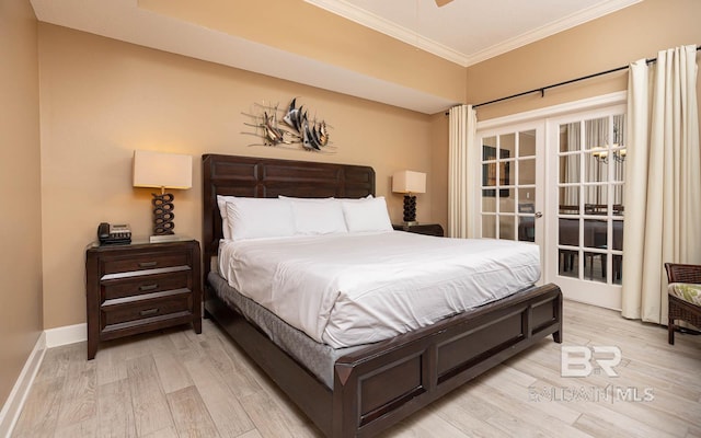 bedroom featuring light wood finished floors, french doors, baseboards, and crown molding