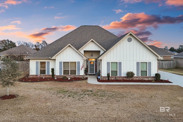 modern farmhouse featuring a lawn