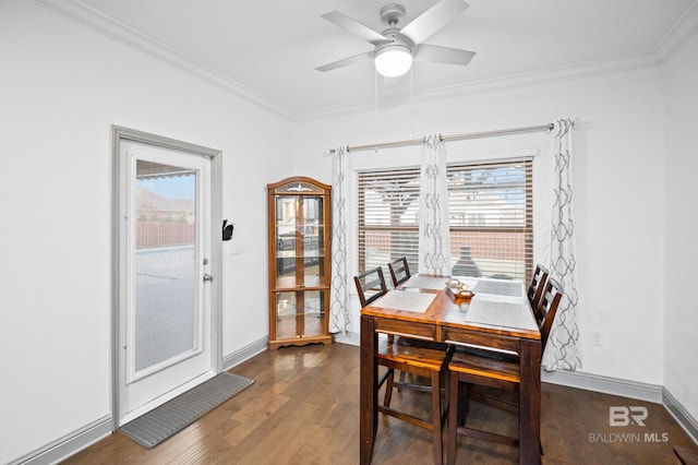 dining space with crown molding, dark hardwood / wood-style floors, and ceiling fan