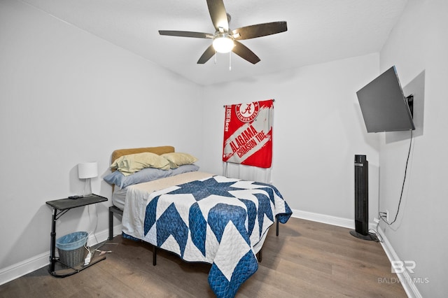 bedroom with ceiling fan and wood-type flooring