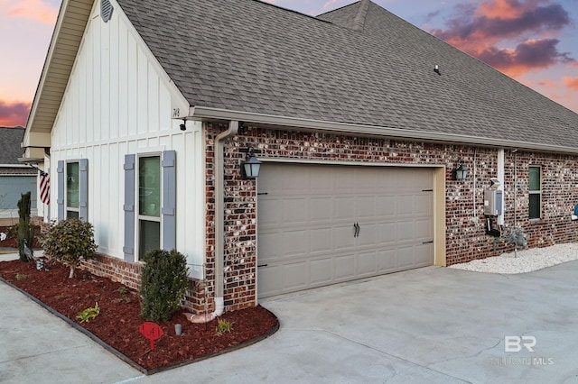 property exterior at dusk with a garage