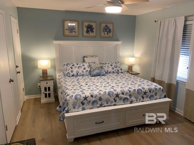 bedroom featuring light hardwood / wood-style flooring and ceiling fan