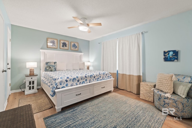 bedroom featuring ceiling fan and light wood-type flooring