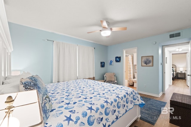 bedroom with ceiling fan, light hardwood / wood-style floors, and ensuite bath