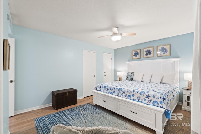 bedroom featuring ceiling fan and hardwood / wood-style floors