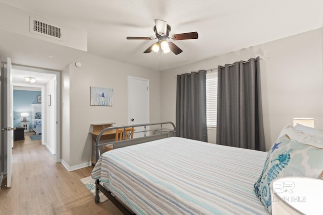 bedroom featuring ceiling fan and light hardwood / wood-style floors