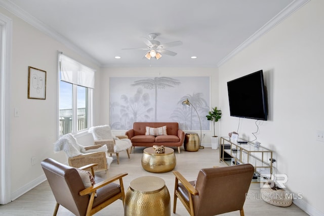 living room with ceiling fan, light hardwood / wood-style floors, and ornamental molding