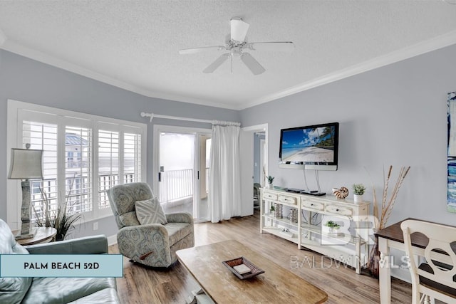 22984 Perdido Beach Blvd Unit 52D, Orange Beach, AL 36561 - living room featuring wood finished floors, a textured ceiling, crown molding, and ceiling fan