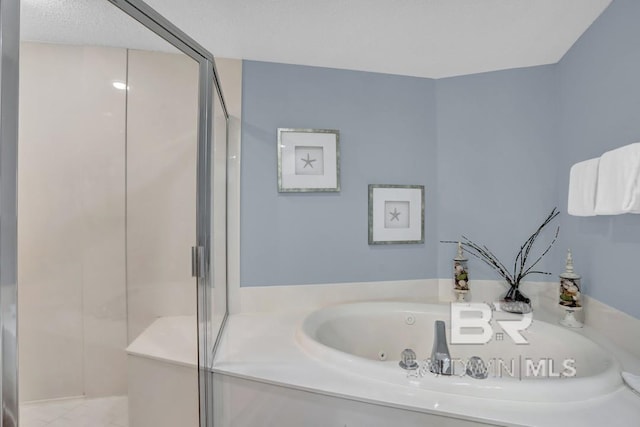 22984 Perdido Beach Blvd Unit 52D, Orange Beach, AL 36561 - bathroom with a tub with jets and a stall shower