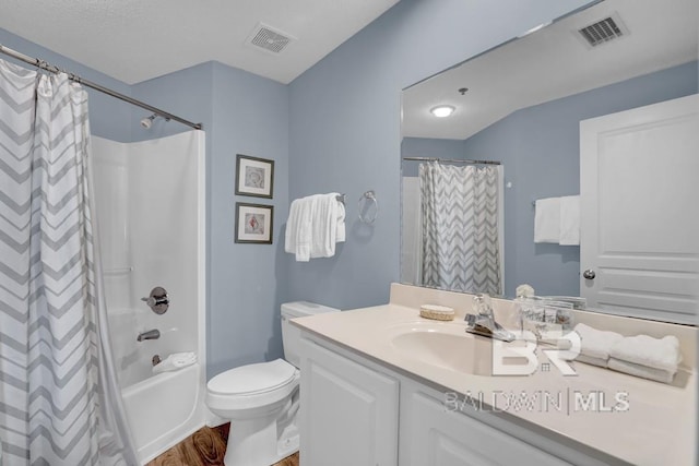 22984 Perdido Beach Blvd Unit 52D, Orange Beach, AL 36561 - full bathroom featuring wood finished floors, visible vents, vanity, and toilet