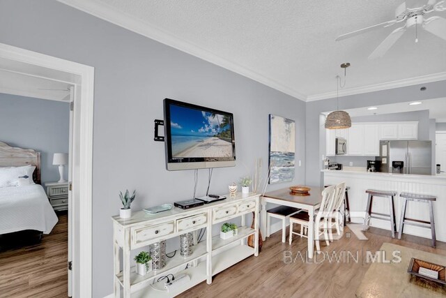 22984 Perdido Beach Blvd Unit 52D, Orange Beach, AL 36561 - interior space featuring wood finished floors, a ceiling fan, and ornamental molding