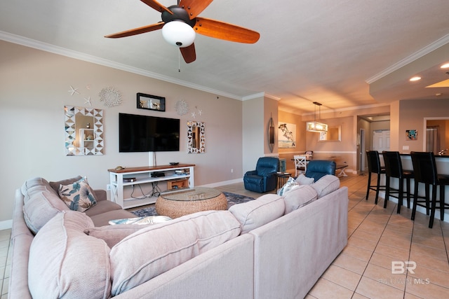 tiled living room featuring ceiling fan and ornamental molding