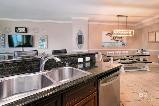 kitchen with sink, stainless steel dishwasher, dark stone countertops, ornamental molding, and decorative light fixtures