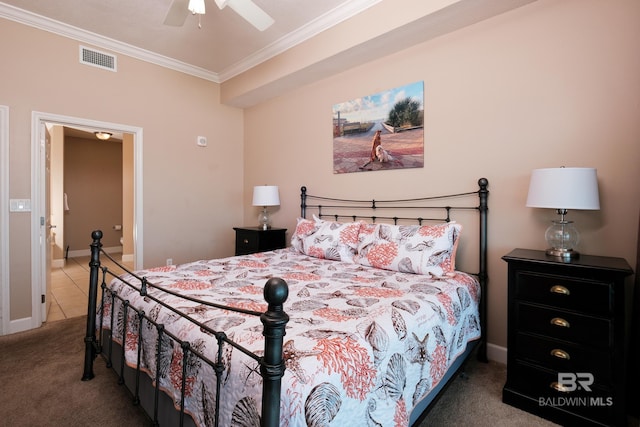 carpeted bedroom featuring ceiling fan and crown molding