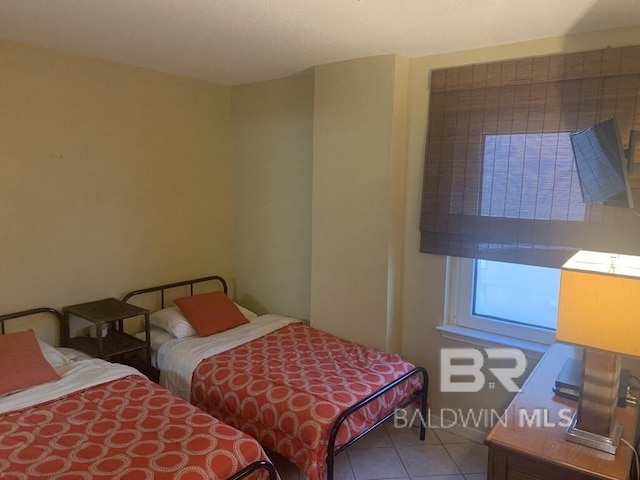 bedroom featuring tile patterned floors