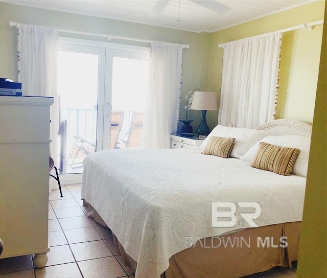 bedroom with ceiling fan and tile patterned floors