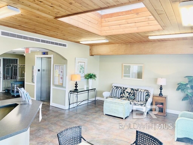 living room with wooden ceiling, elevator, and arched walkways