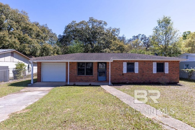 ranch-style house featuring brick siding, a front lawn, a garage, and concrete driveway