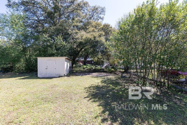view of yard with a storage shed and an outdoor structure