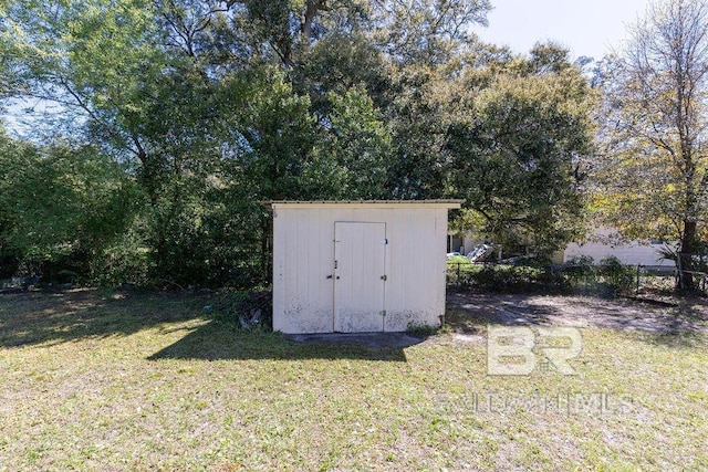 view of shed with fence