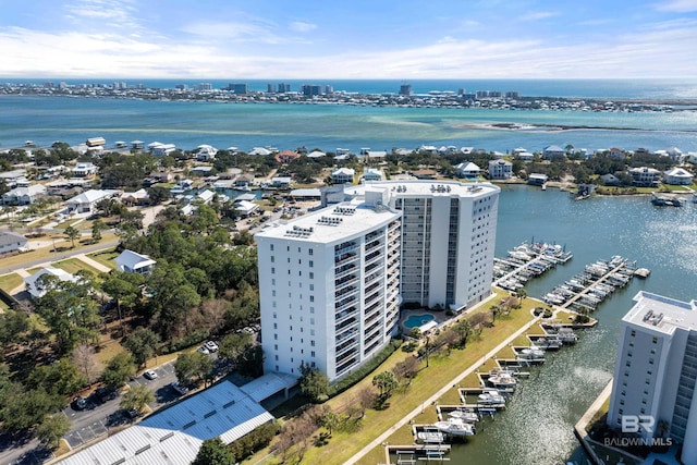 birds eye view of property with a water view and a city view