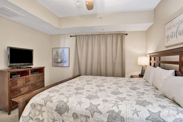 bedroom with ceiling fan and carpet flooring