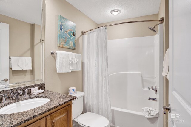 full bathroom with toilet, a textured ceiling, shower / bath combo with shower curtain, and vanity