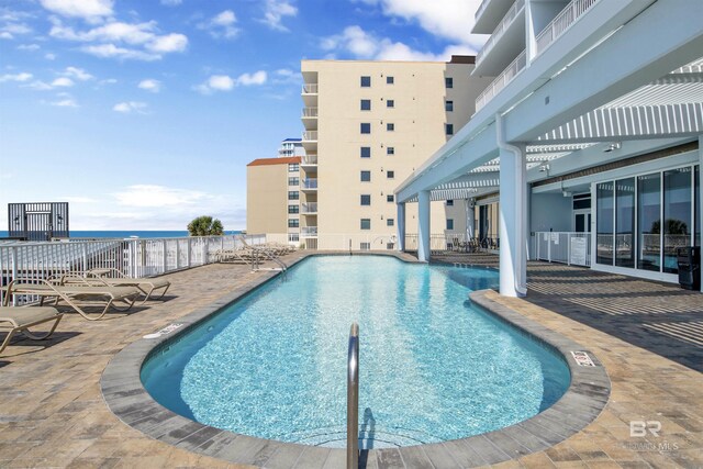 view of swimming pool with a patio