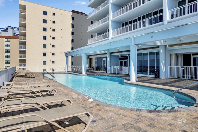 view of swimming pool featuring a patio area