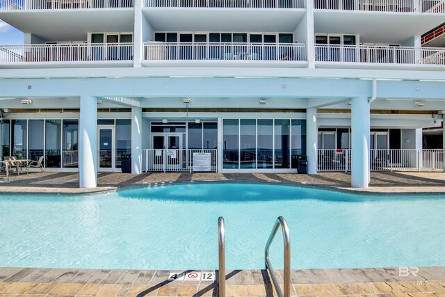 view of swimming pool with a patio area