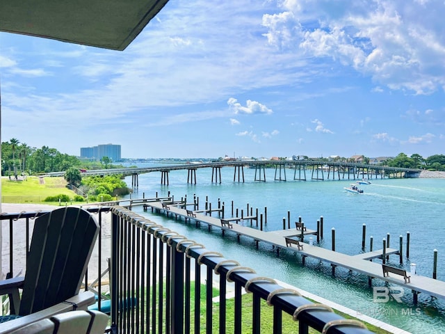 balcony featuring a dock and a water view