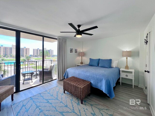 bedroom with ceiling fan, access to outside, and wood-type flooring