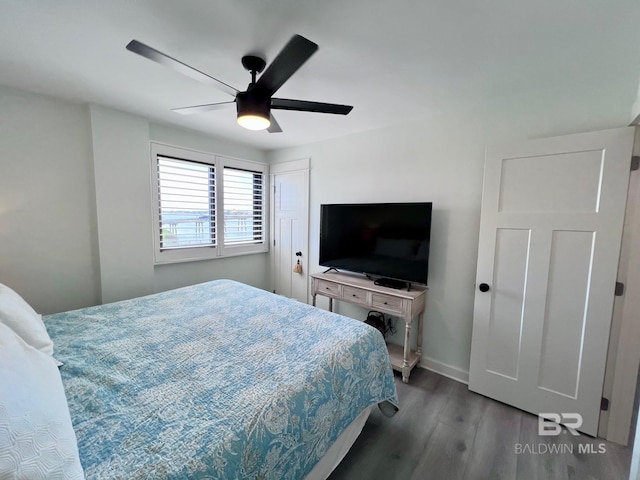 bedroom featuring ceiling fan and hardwood / wood-style floors