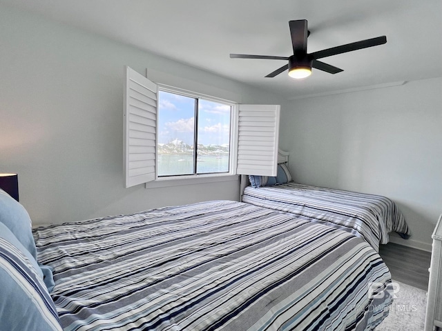 bedroom featuring ceiling fan and hardwood / wood-style floors