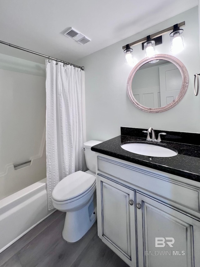 full bathroom with toilet, vanity, shower / bath combo, and wood-type flooring