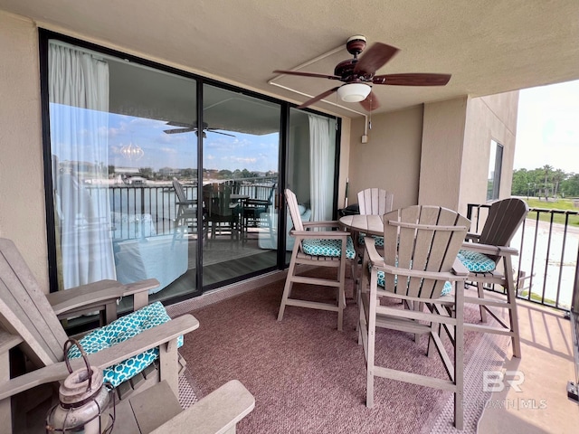 balcony featuring ceiling fan