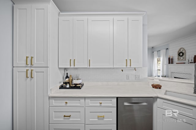 kitchen featuring decorative backsplash, white cabinets, dishwasher, and light countertops