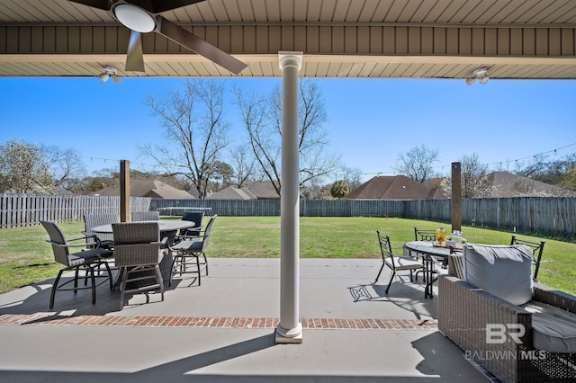 view of patio featuring outdoor dining area and a fenced backyard