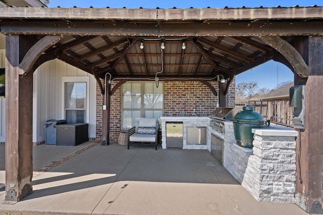 view of patio featuring a gazebo, area for grilling, and grilling area