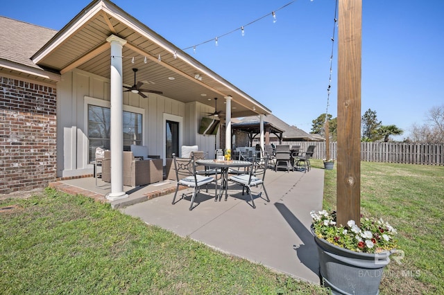 view of patio / terrace featuring outdoor dining space, an outdoor hangout area, a ceiling fan, and fence