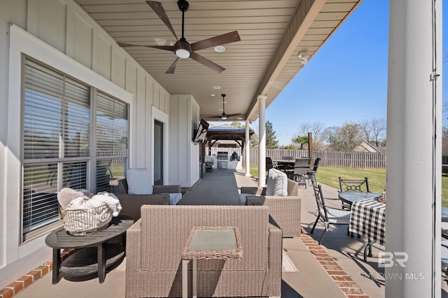 view of patio / terrace with ceiling fan, outdoor dining space, outdoor lounge area, and fence