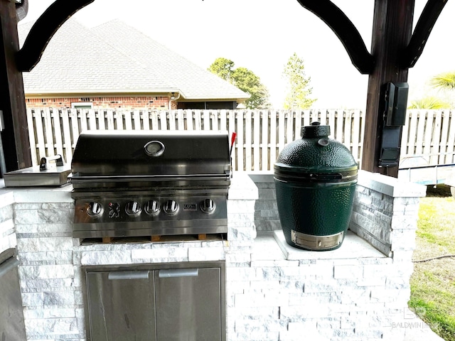 view of patio / terrace with grilling area, area for grilling, and fence