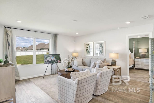 living room with light hardwood / wood-style floors