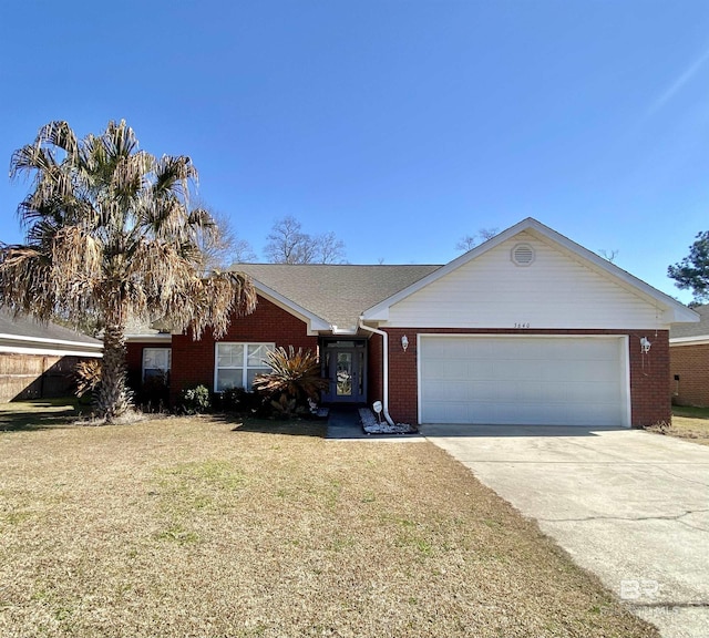 ranch-style house featuring a garage and a front lawn