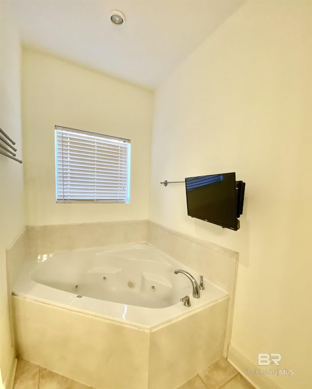 bathroom featuring tile patterned flooring and a washtub