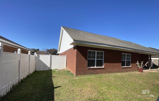 view of home's exterior featuring a yard