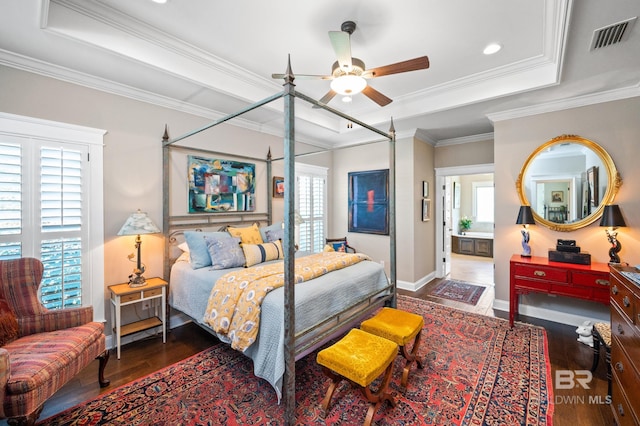 bedroom with ceiling fan, a raised ceiling, dark hardwood / wood-style floors, and crown molding