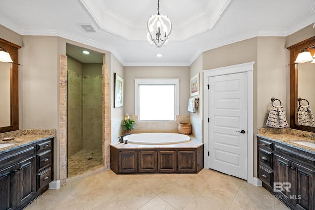 bathroom with shower with separate bathtub, a notable chandelier, a raised ceiling, ornamental molding, and vanity