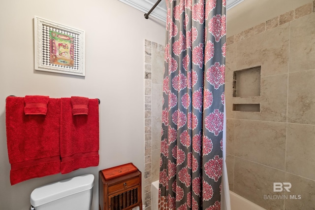 bathroom featuring shower / bath combo and toilet